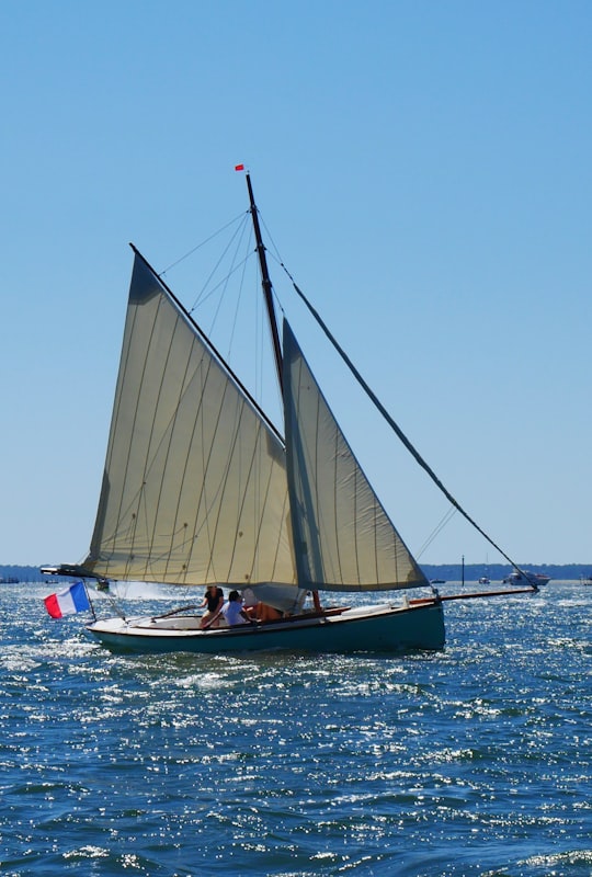 white sail boat on sea during daytime in Arcachon France