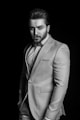 man in suit jacket grayscale photo