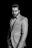 man in suit jacket grayscale photo