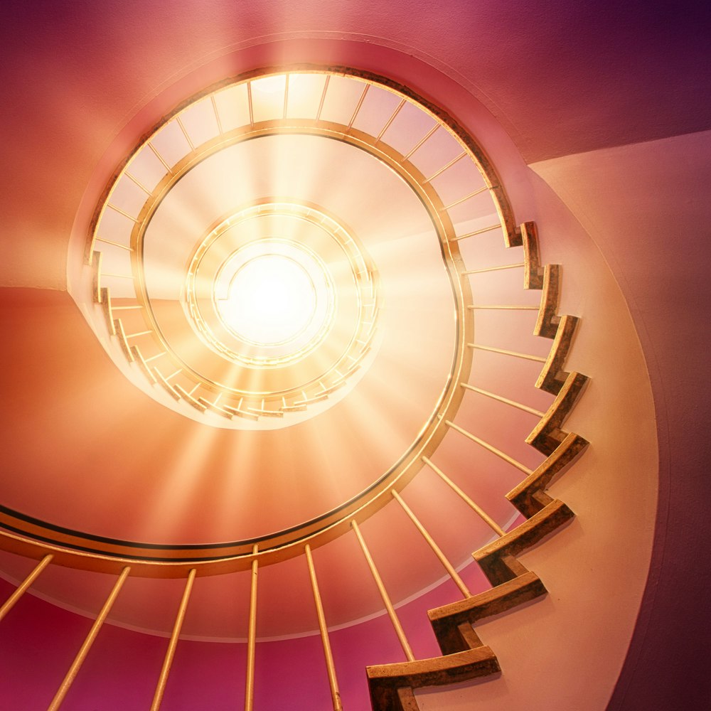 brown spiral staircase with purple lights