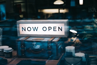 there is a sign that says now open