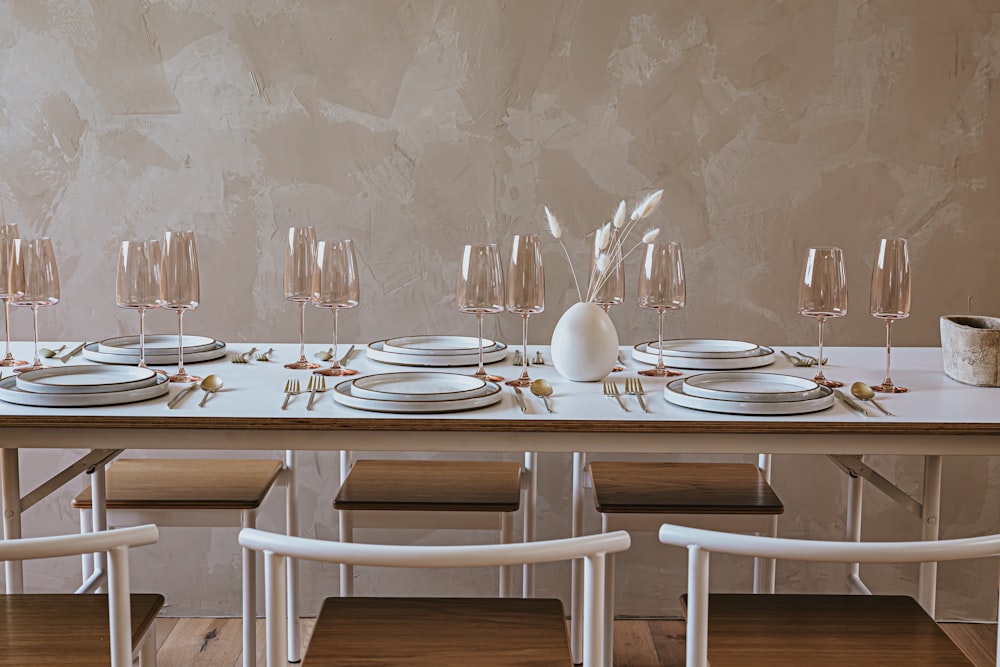 white wooden table with chairs