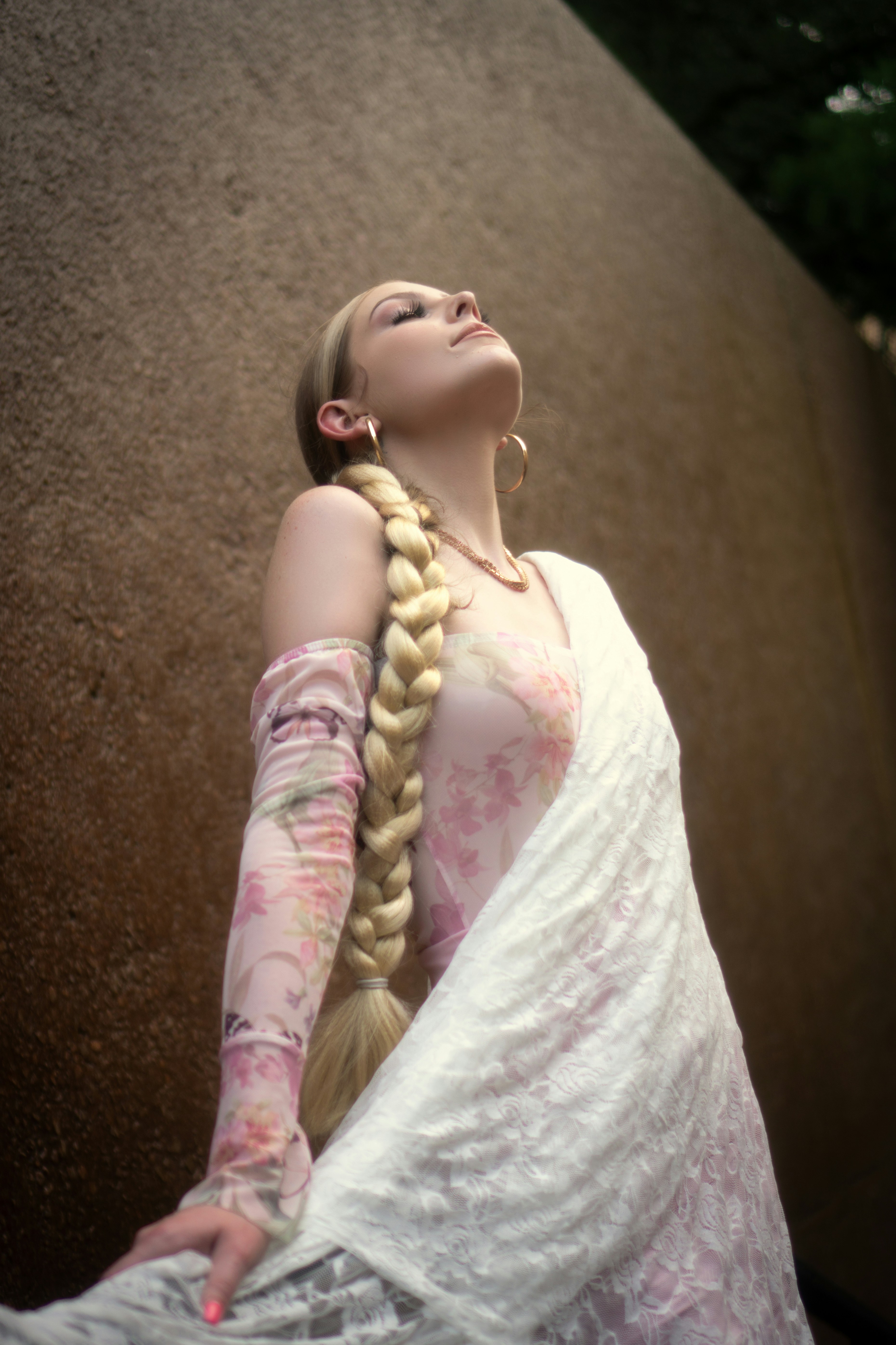 wearing a braid while wearing a custom mesh hair loss system