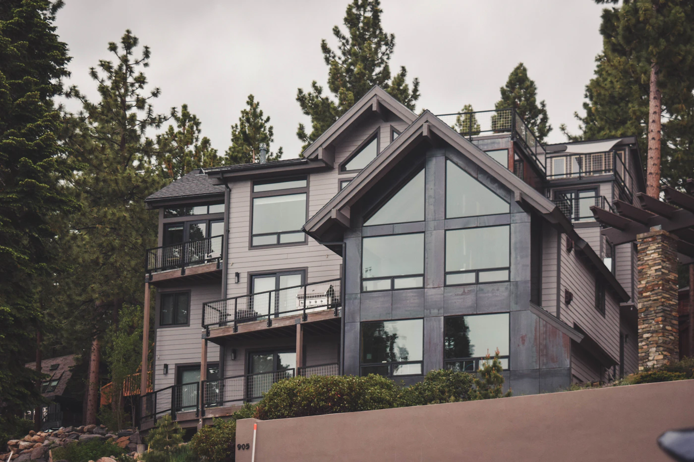 Modern two-story home among tall pine trees