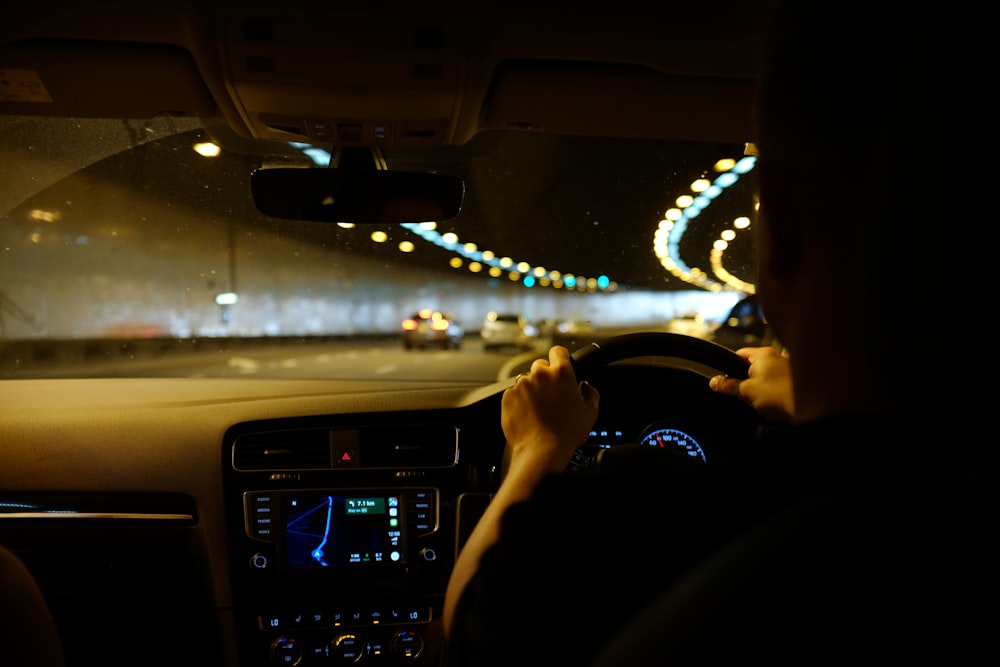 person driving car during night time