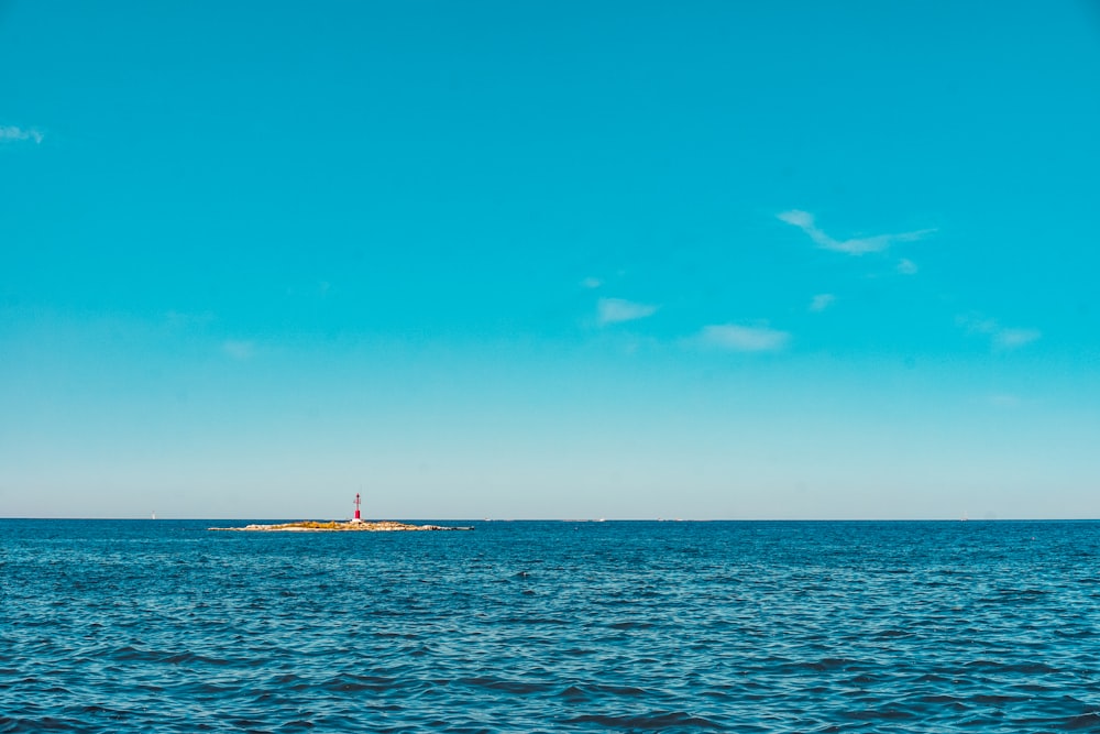 body of water under blue sky during daytime