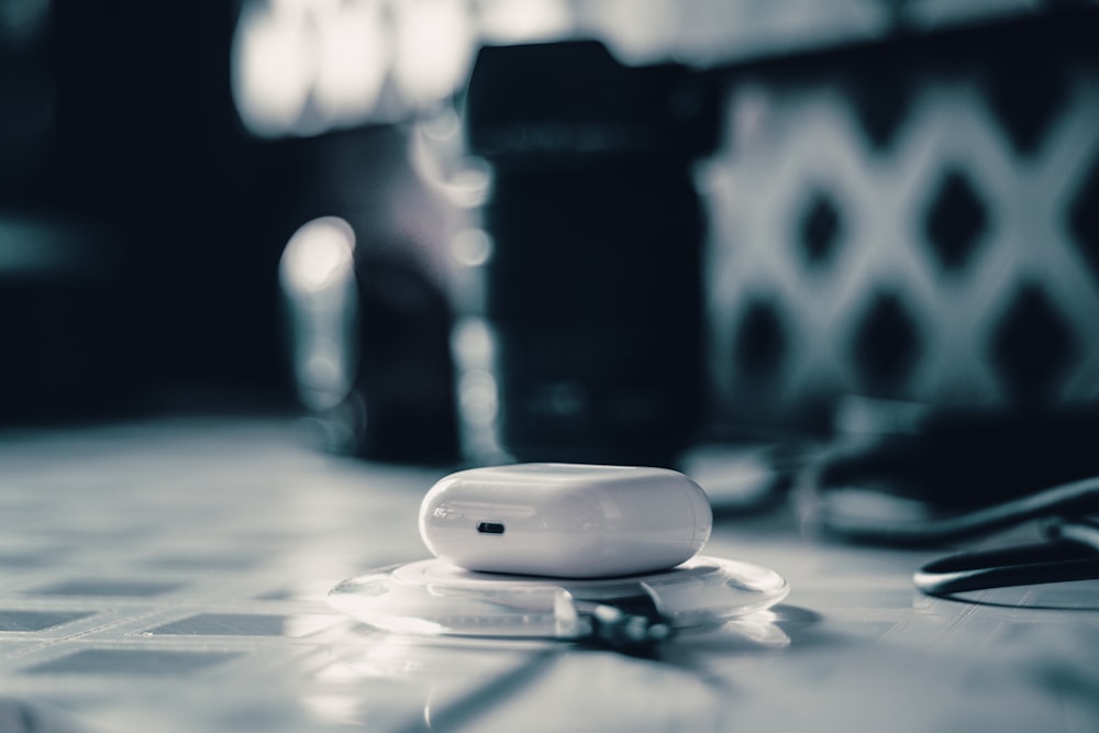 white oval medication pill on white and gray surface