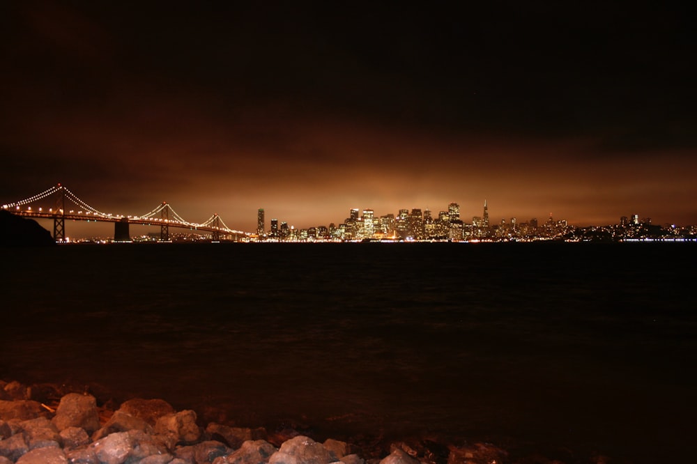 bridge over the sea during night time