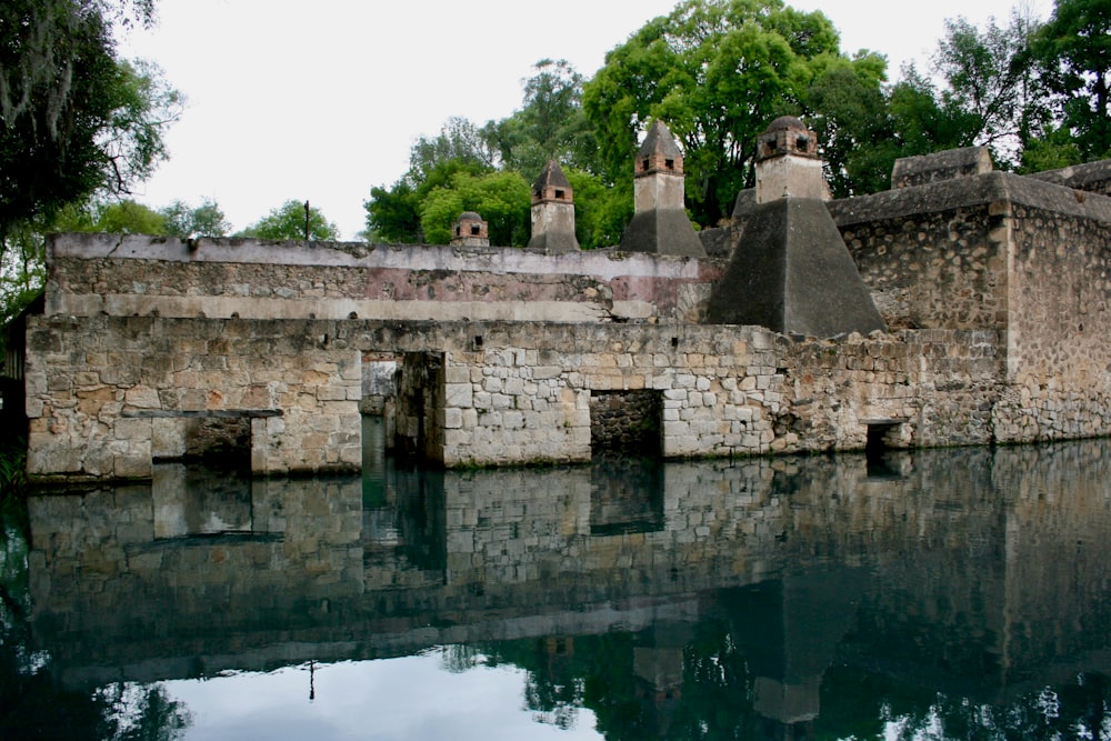 gray concrete building near body of water during daytime