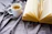A warm cup of mushroom coffee steaming gently on a wooden table beside an open wellness ebook.