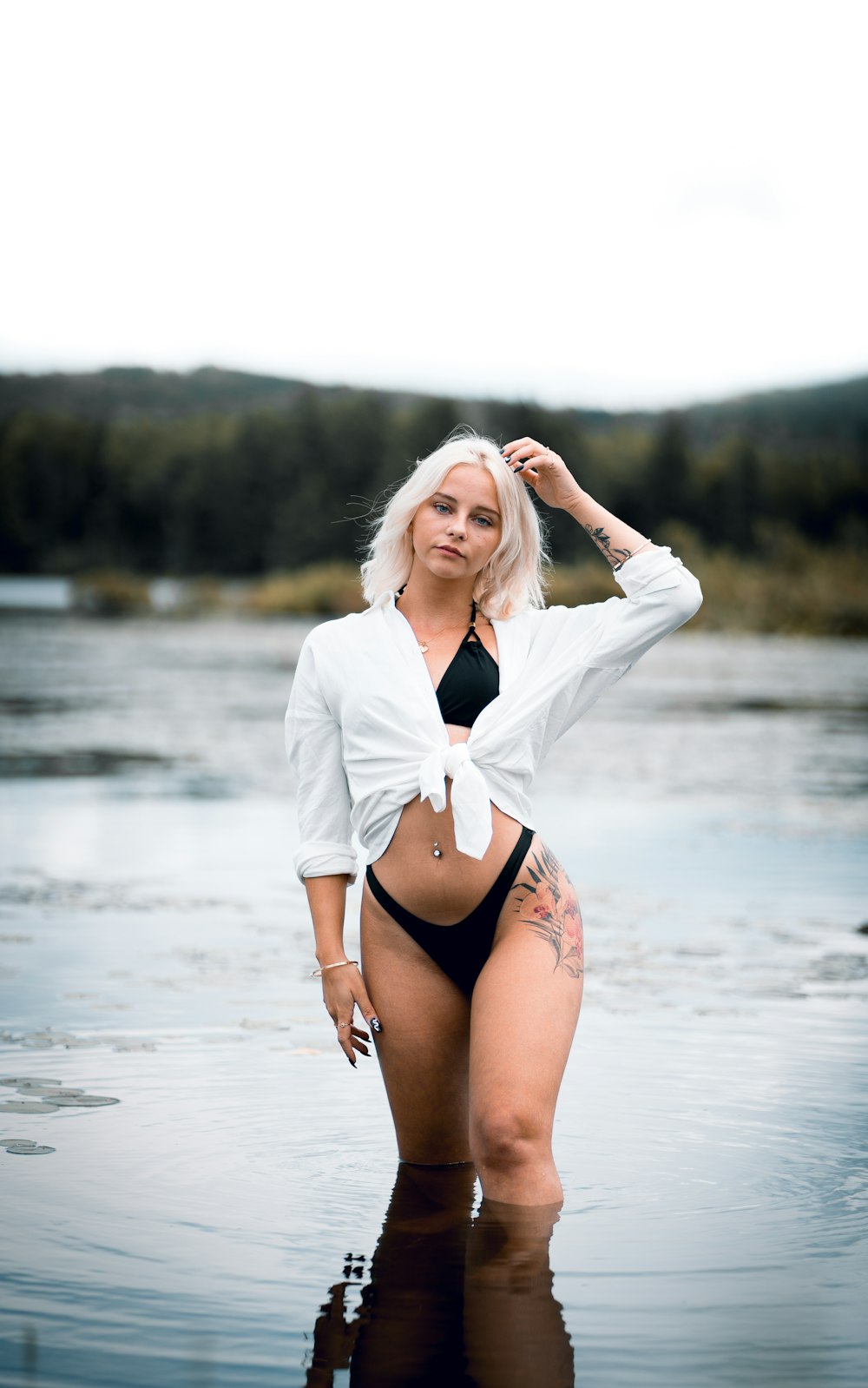 a woman in a bikini standing in the water
