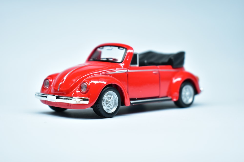 red convertible coupe on white background