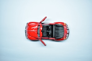 Side view of a limited edition 1:32 scale vintage race car with opening doors and detailed interior lighting