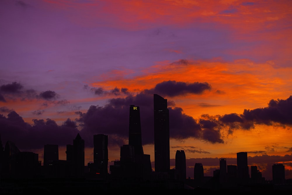 silhouette of city buildings during sunset