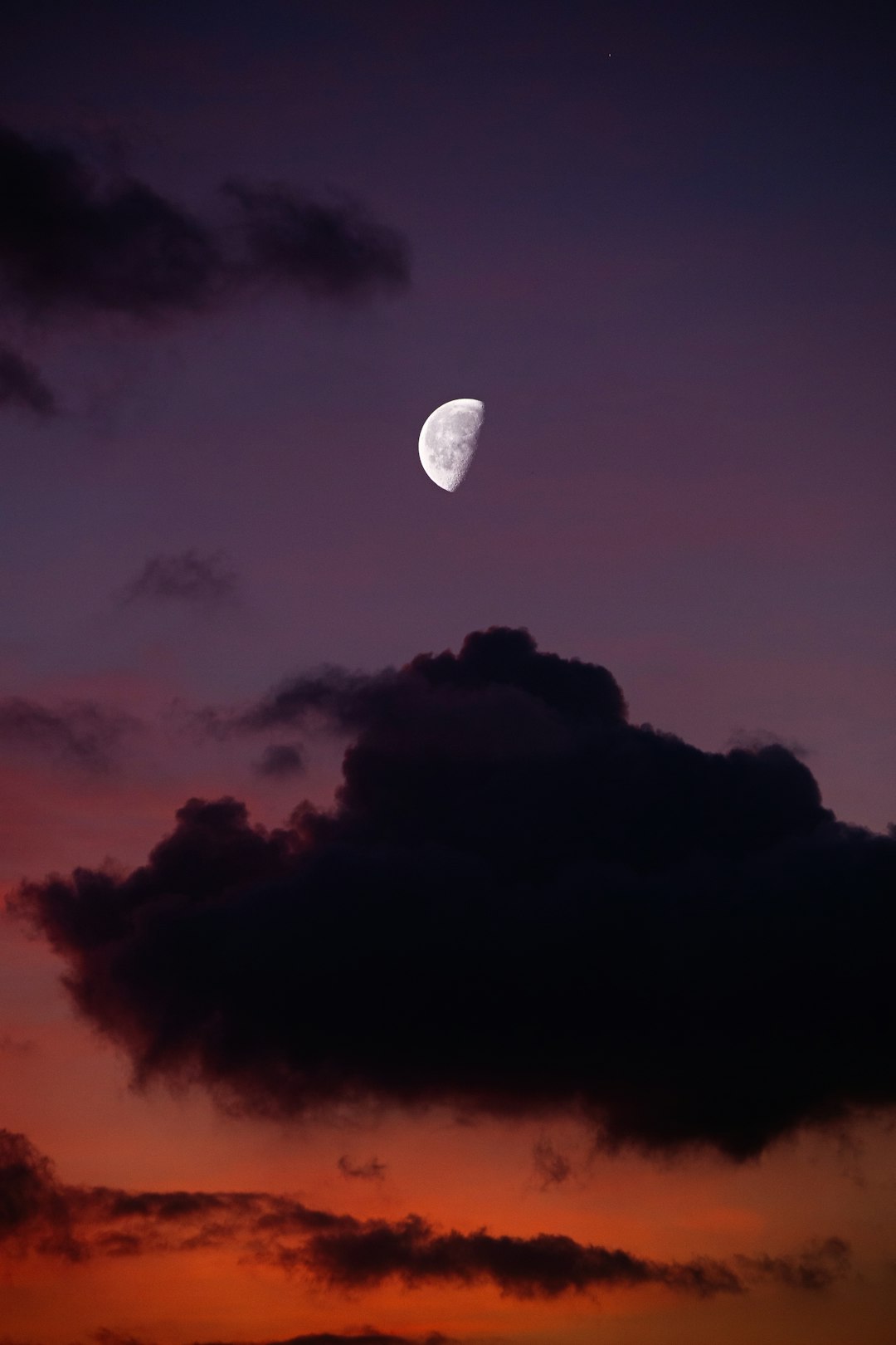 hot air balloon flying over clouds