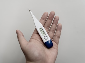 white and blue thermometer at 36 9