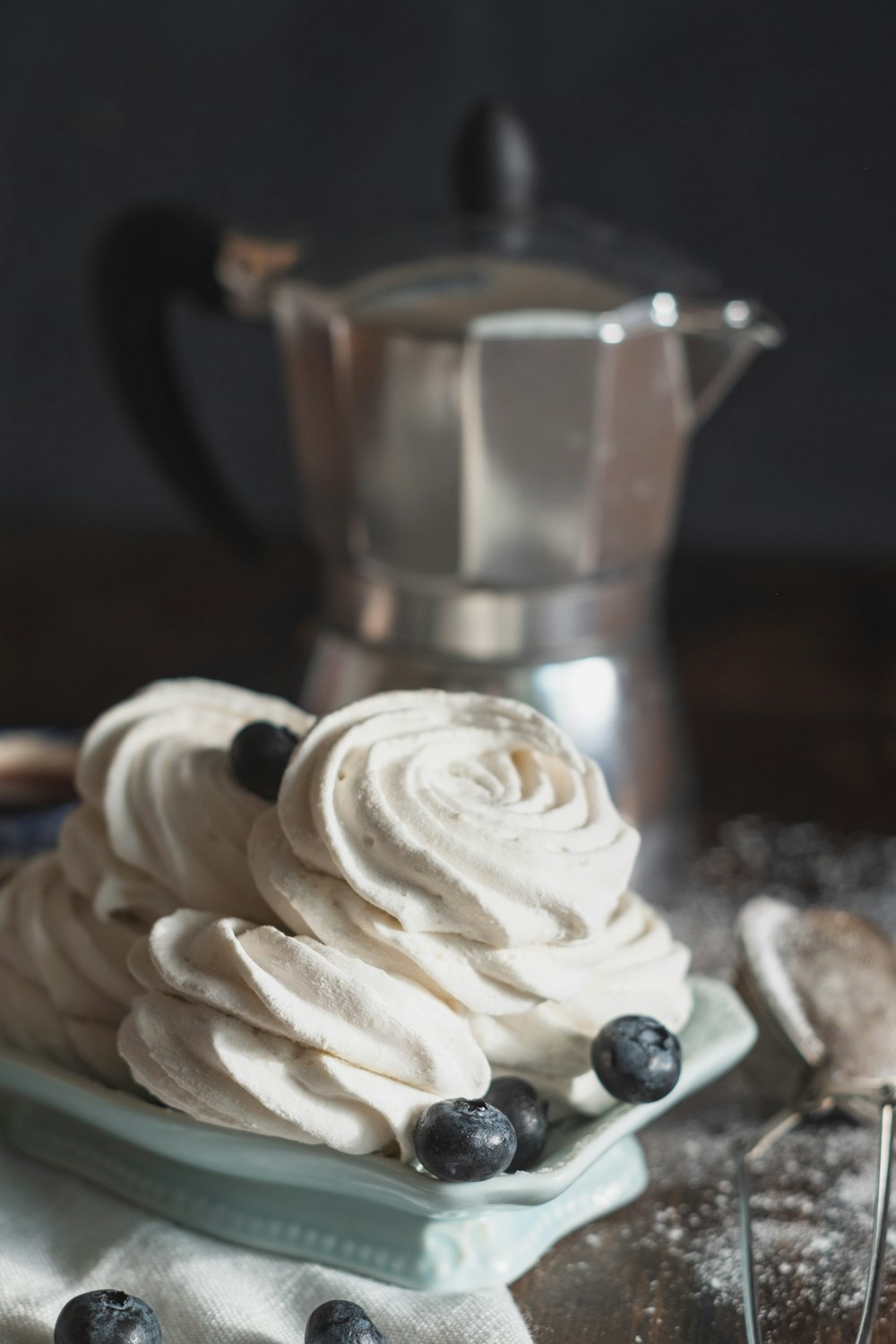 white icing on brown cupcake