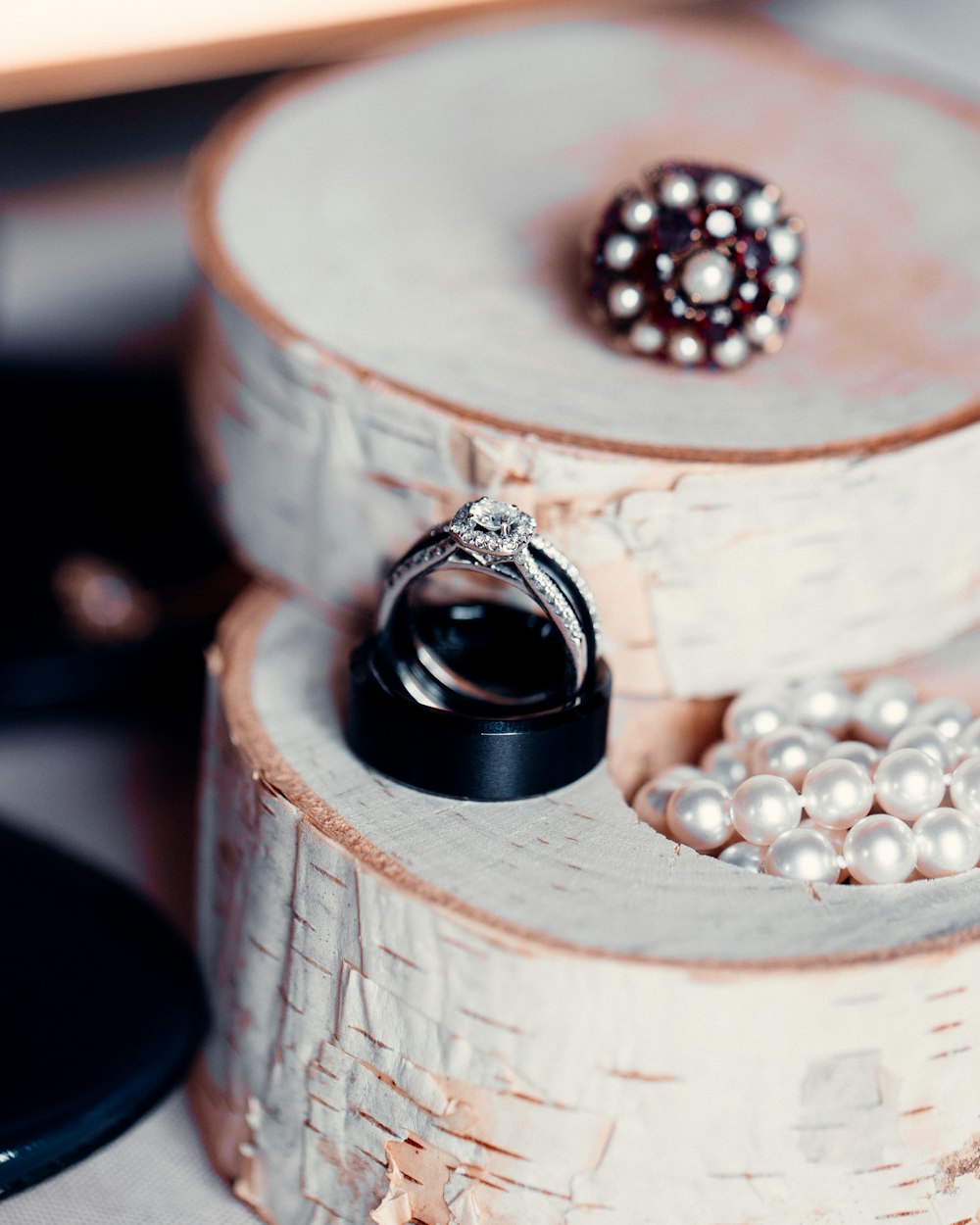 silver and black round accessory on brown wooden table