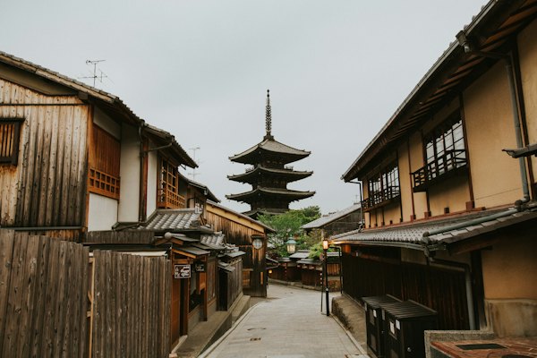 Brown wooden house under white sky during daytime — Kyoto, Japan
