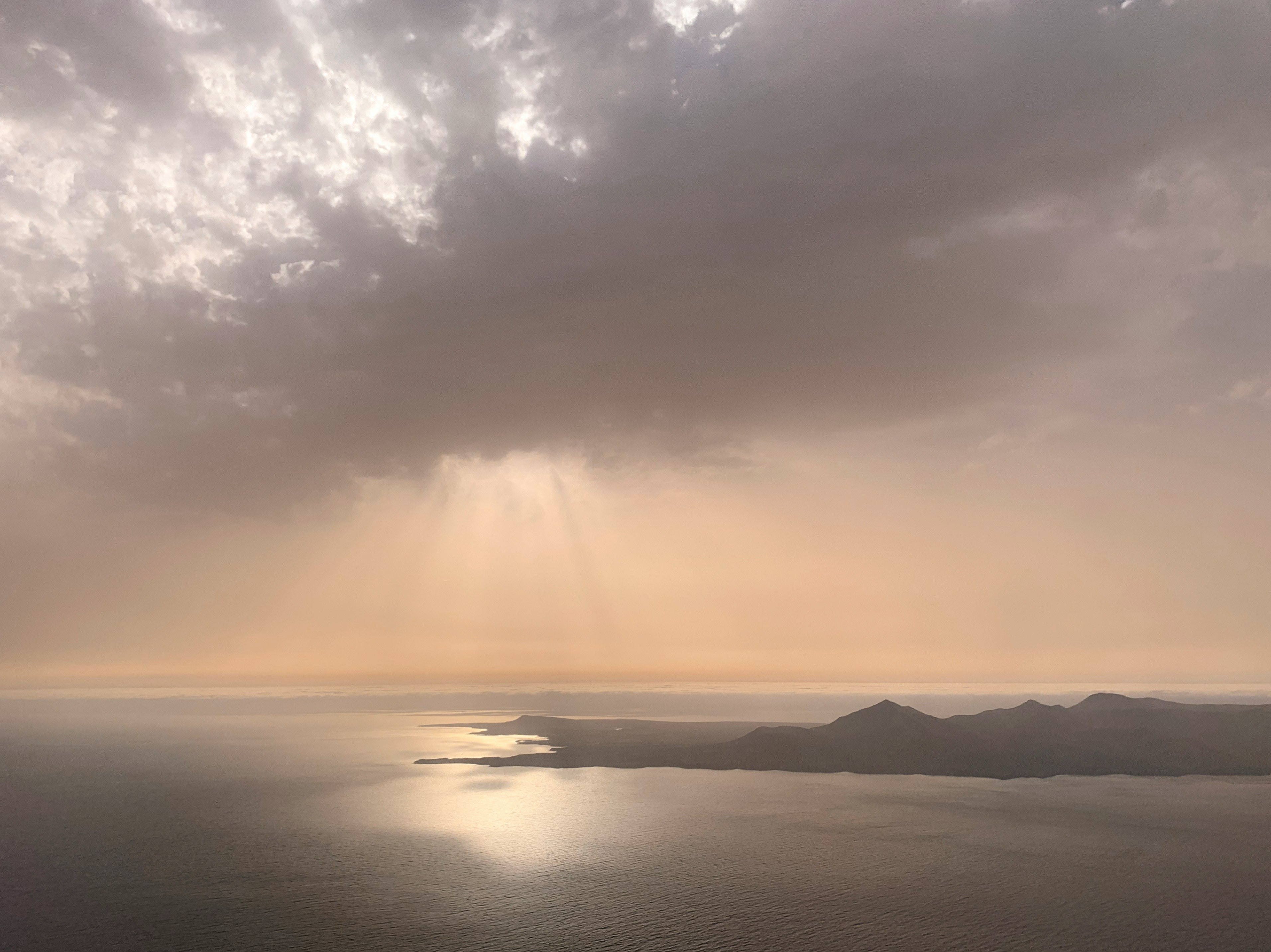 body of water under cloudy sky during daytime