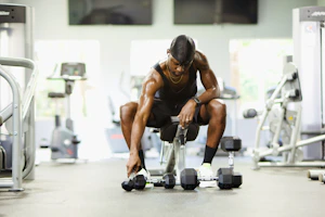Close-up of sleek fitness gear laid out on a gym bench, ready for use.