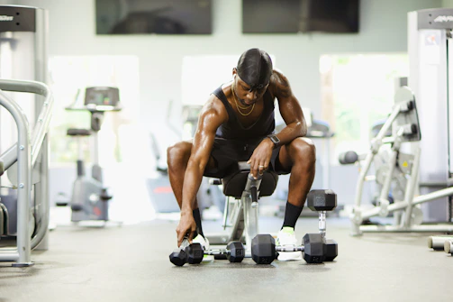 Close-up of sleek fitness gear laid out on a gym bench, ready for use.