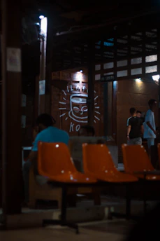 A warm, inviting room filled with animated agents chatting over coffee