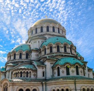 green and blue dome building under blue sky during daytime