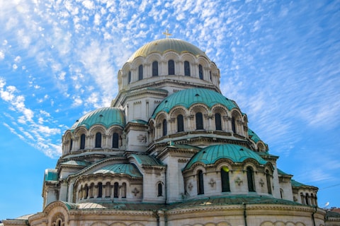 green and blue dome building under blue sky during daytime