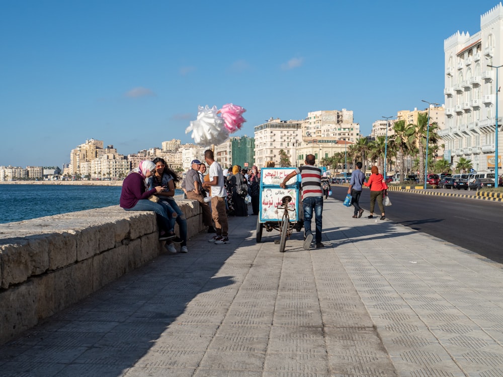 people walking on sidewalk during daytime