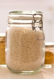 clear glass jar with white powder inside