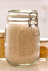 clear glass jar with white powder inside