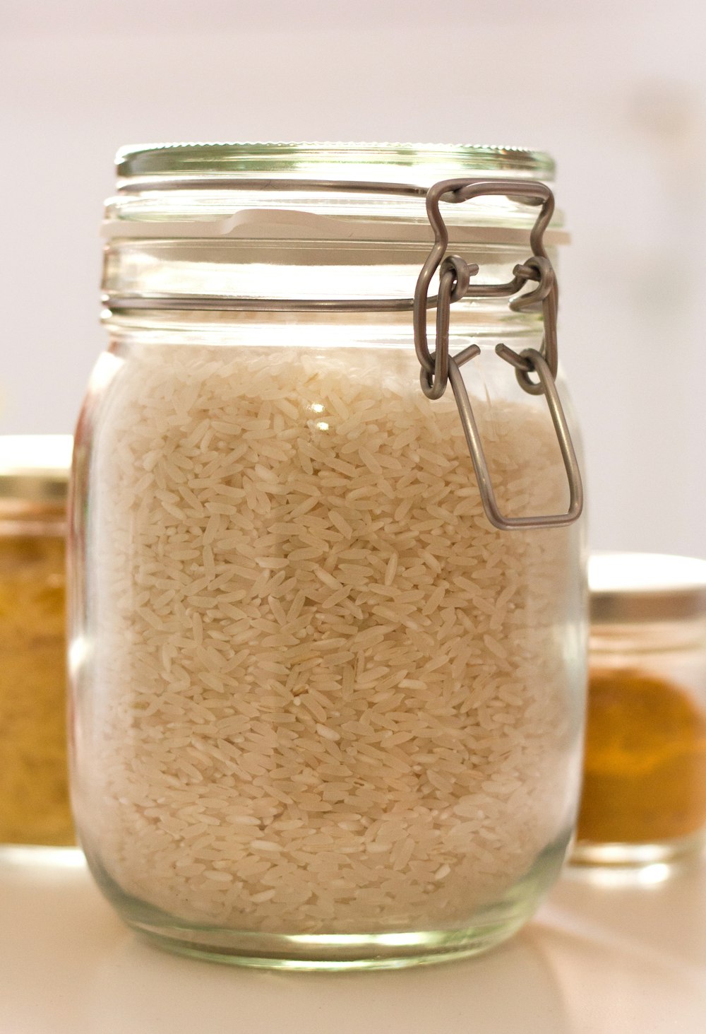 clear glass jar with white powder inside