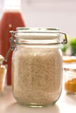 clear glass jar with brown powder inside