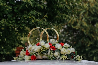 red and white flowers on basket