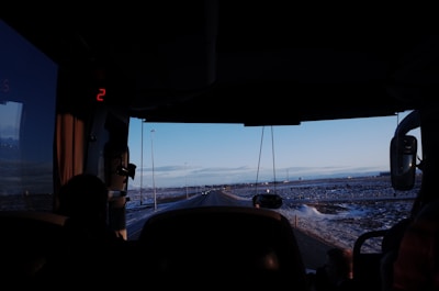 A scenic view from the window of a moving bus.