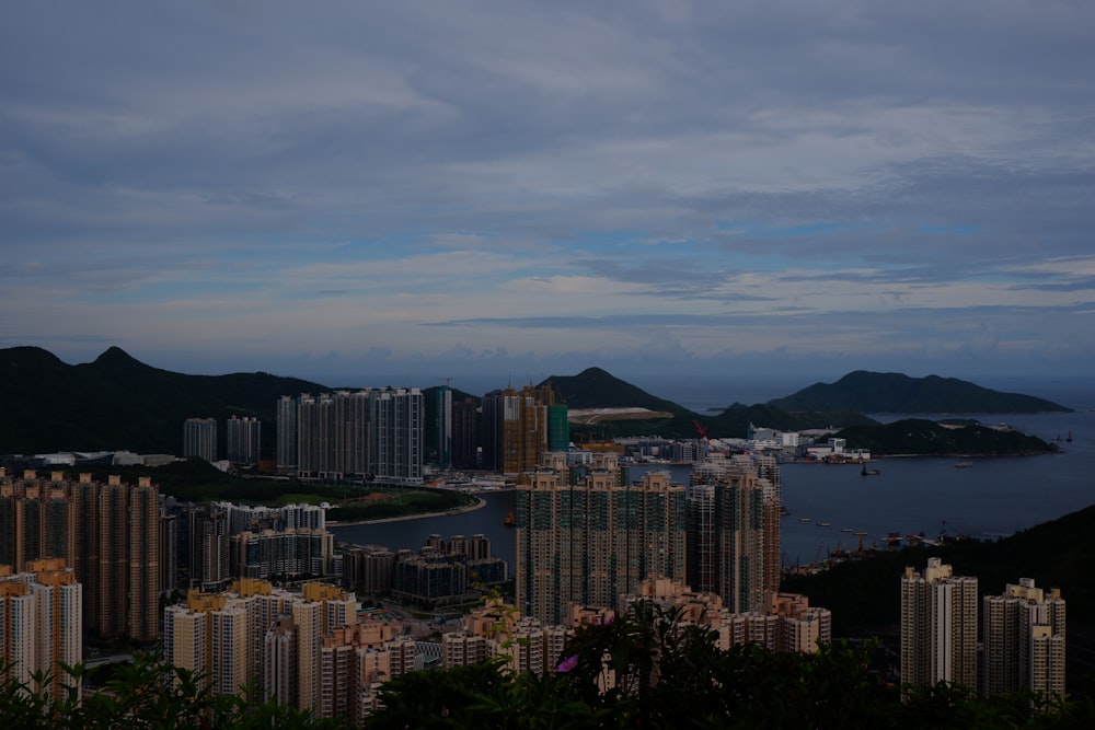 city skyline under cloudy sky during daytime