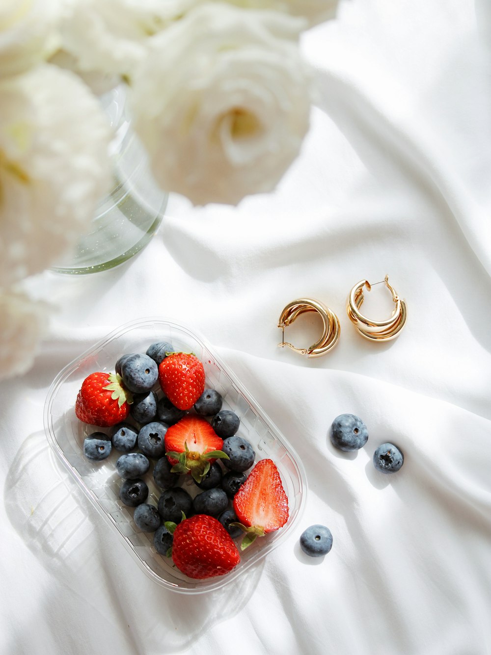 red berries on white ceramic plate