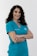 woman in blue crew neck t-shirt smiling