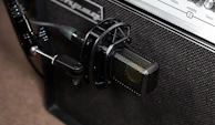 Microphone setup in front of a guitar amp, ready for recording a live session.