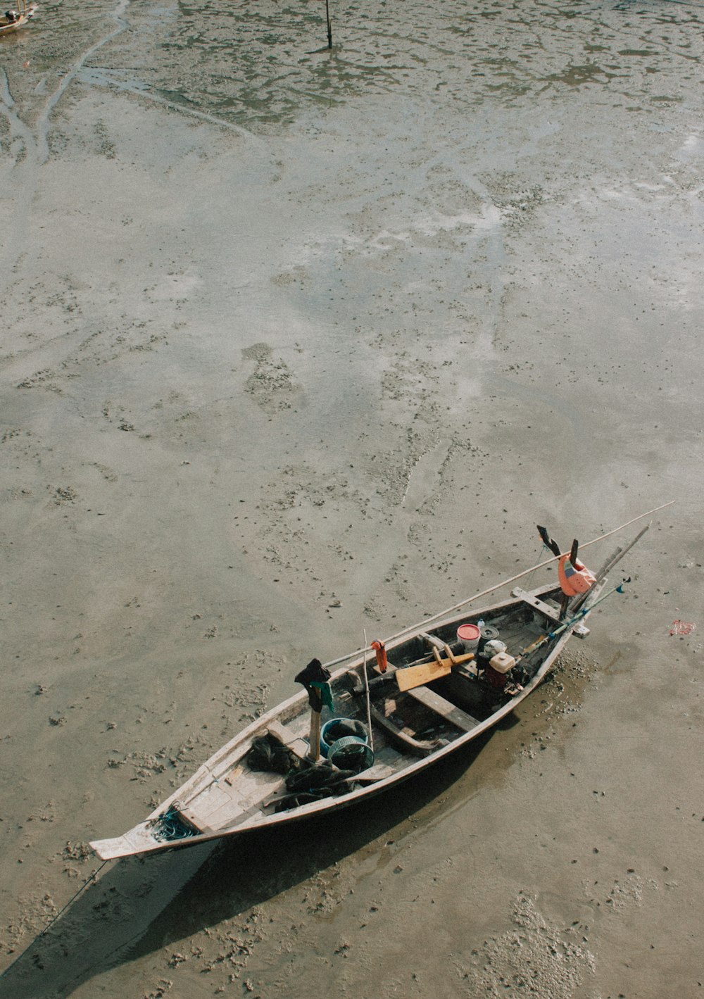 2 person riding on boat on beach during daytime