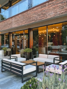 An exterior view of a modern co-working space with outdoor seating.