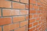Close-up of clean brickwork restored to its original color after pressure washing.