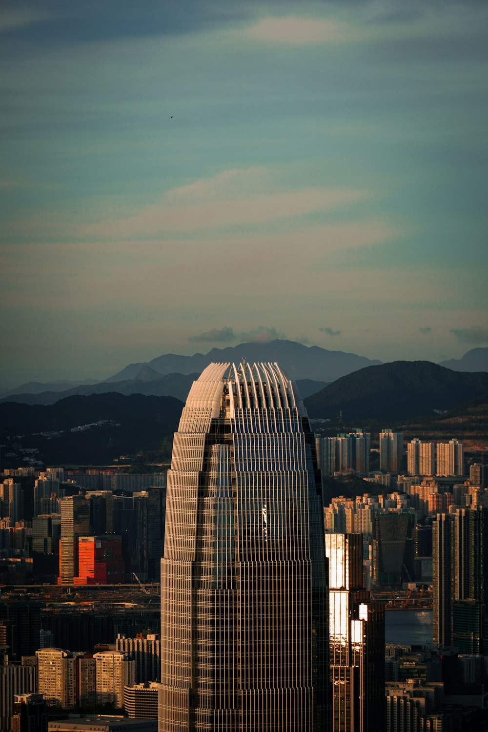 high rise buildings near mountain during daytime