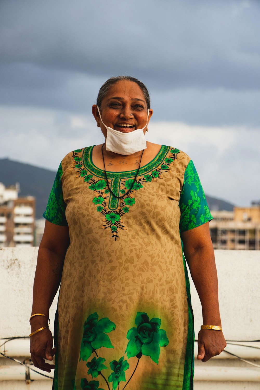 woman in green crew neck t-shirt with face mask