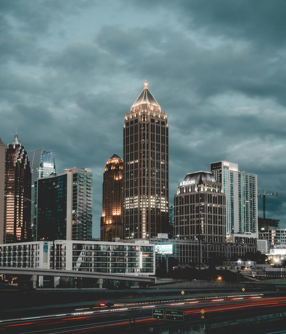 city skyline under gray cloudy sky during daytime