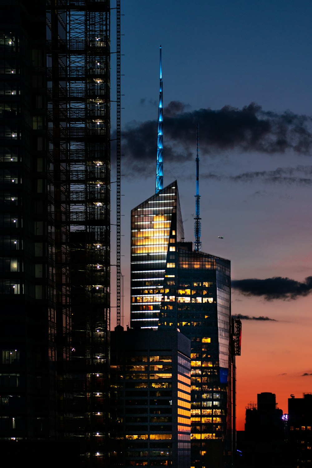 black and white concrete building during sunset