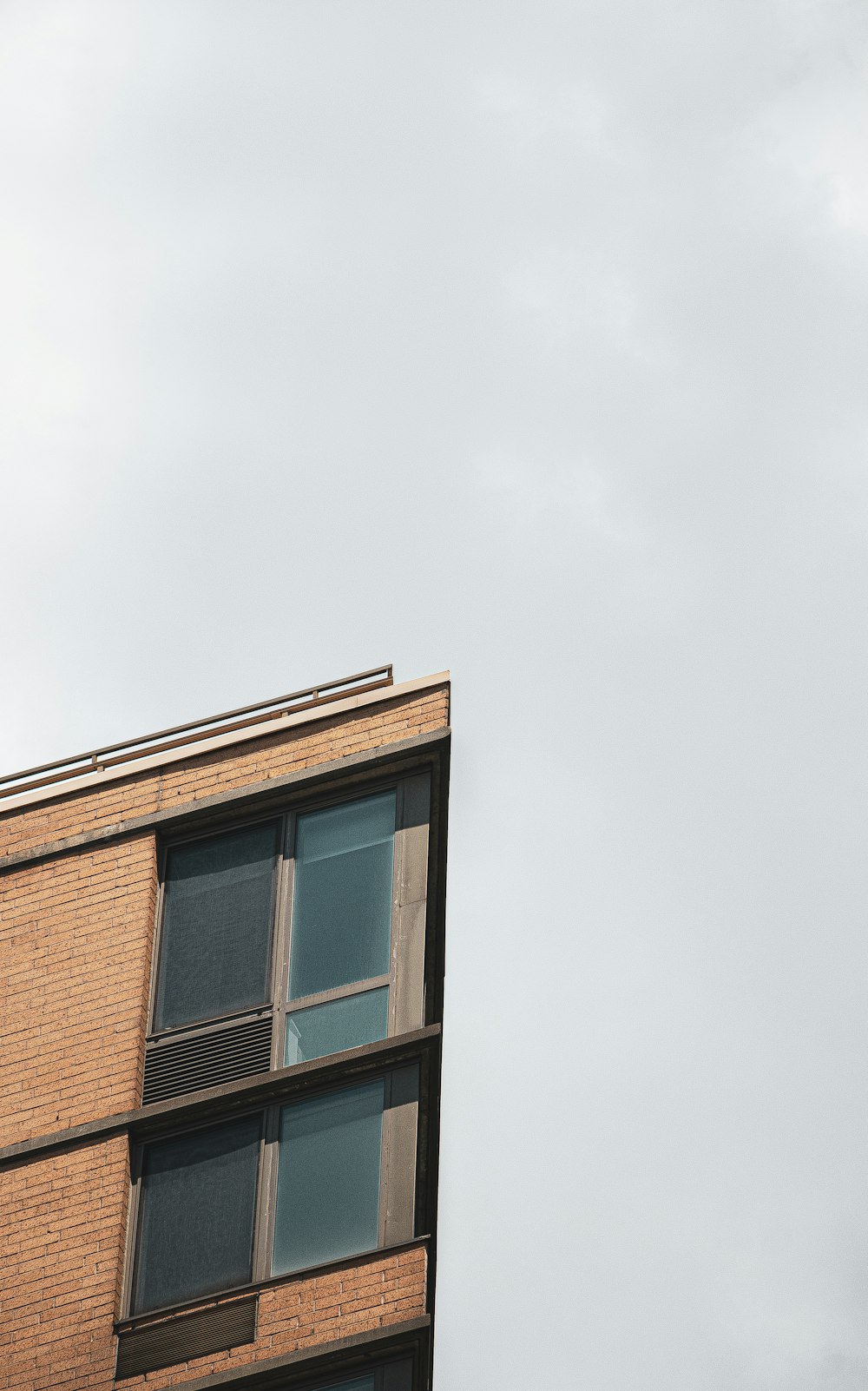 brown concrete building under white sky during daytime