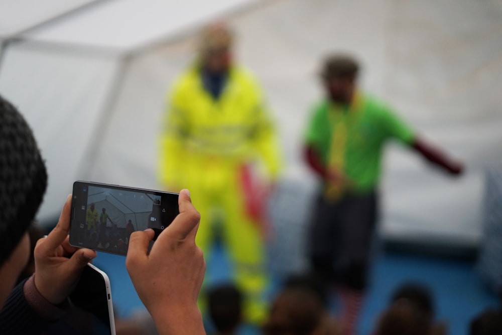 person holding black android smartphone