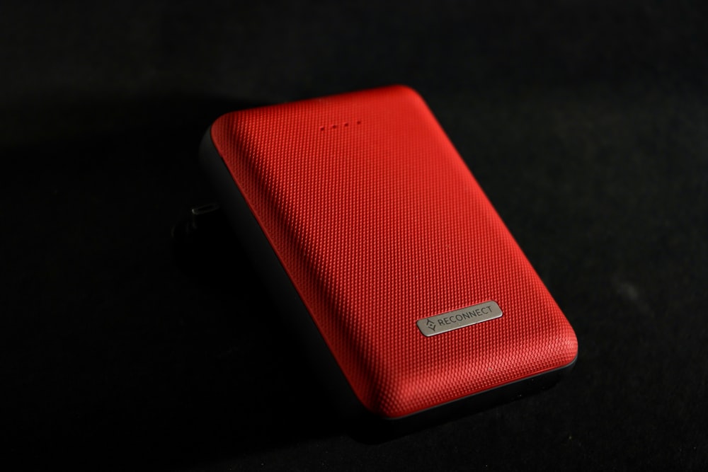 red leather case on black surface